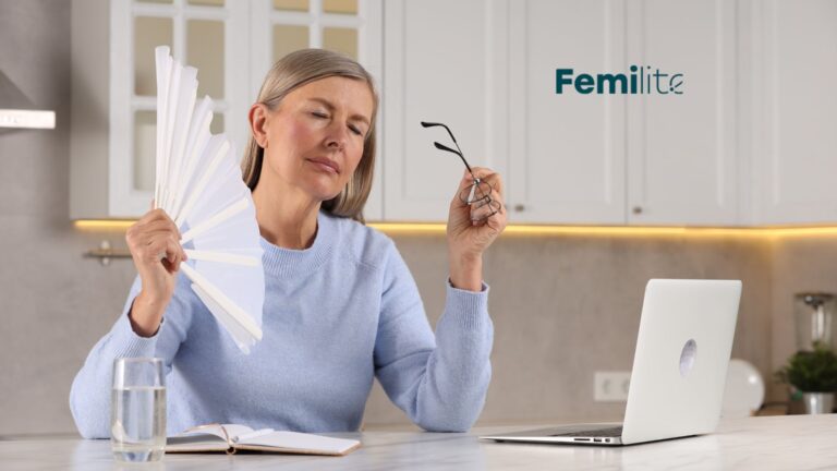 Kobieta zmagająca się z objawami menopauzy.